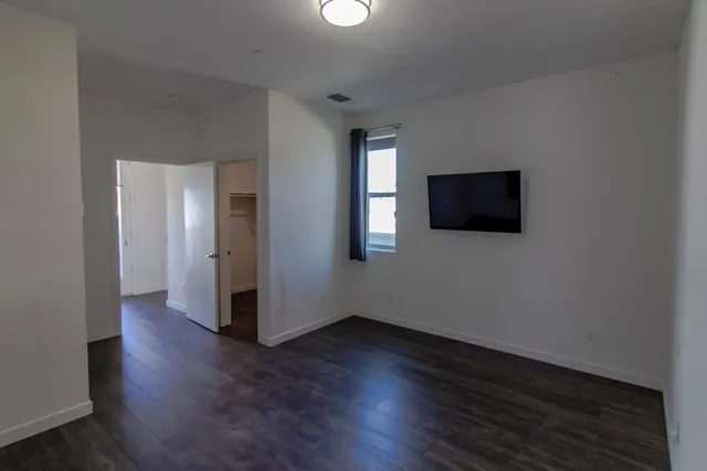 a view of a livingroom with wooden floor