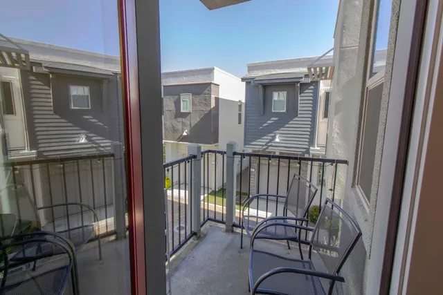 a view of a balcony with furniture