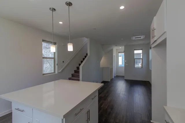 a view of an entryway with wooden floor