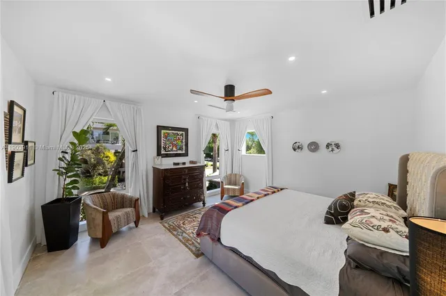 a bedroom with a bed and a couch