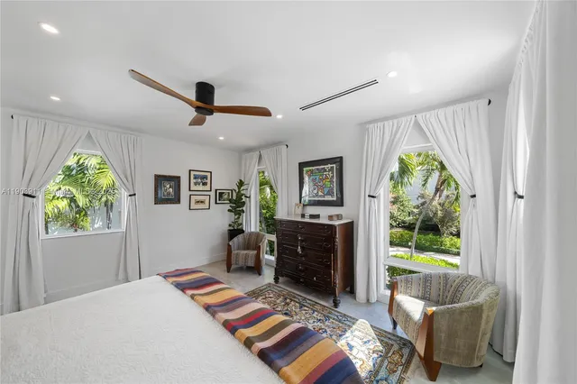 a bedroom with furniture and a fireplace