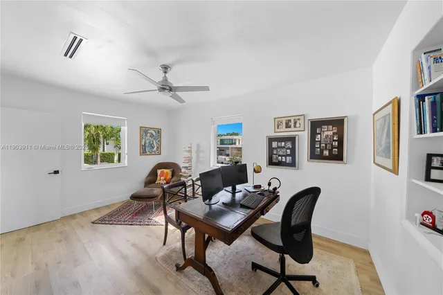 a work room with furniture and windows