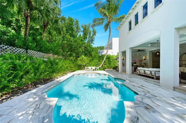 a view of a swimming pool with a patio
