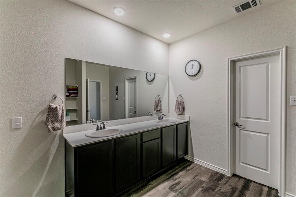 217 Watson Street Red Oak, TX 75154 - Photo 15 of 26 a bathroom with a double vanity sink and a mirror