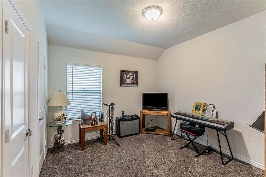 217 Watson Street Red Oak, TX 75154 - Photo 17 of 26 a view of a workspace with furniture and a window