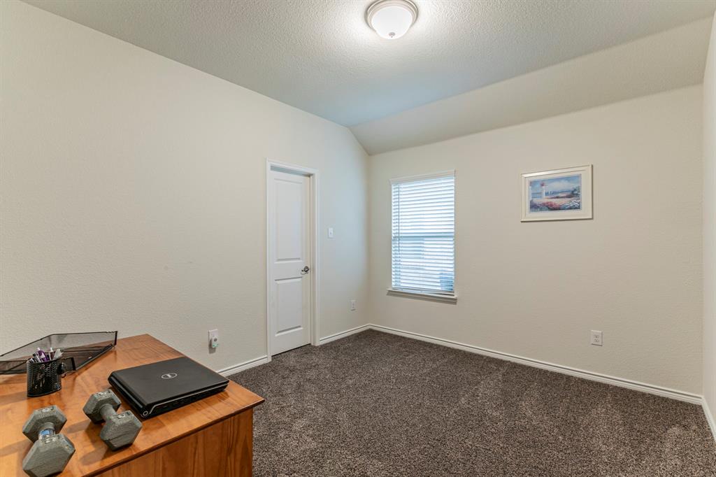 217 Watson Street Red Oak, TX 75154 - Photo 18 of 26 an empty room with windows