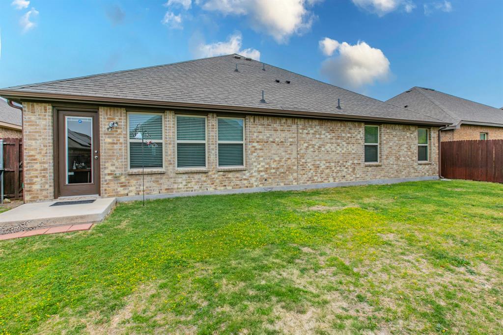 217 Watson Street Red Oak, TX 75154 - Photo 23 of 26 a view of a house with backyard and garden