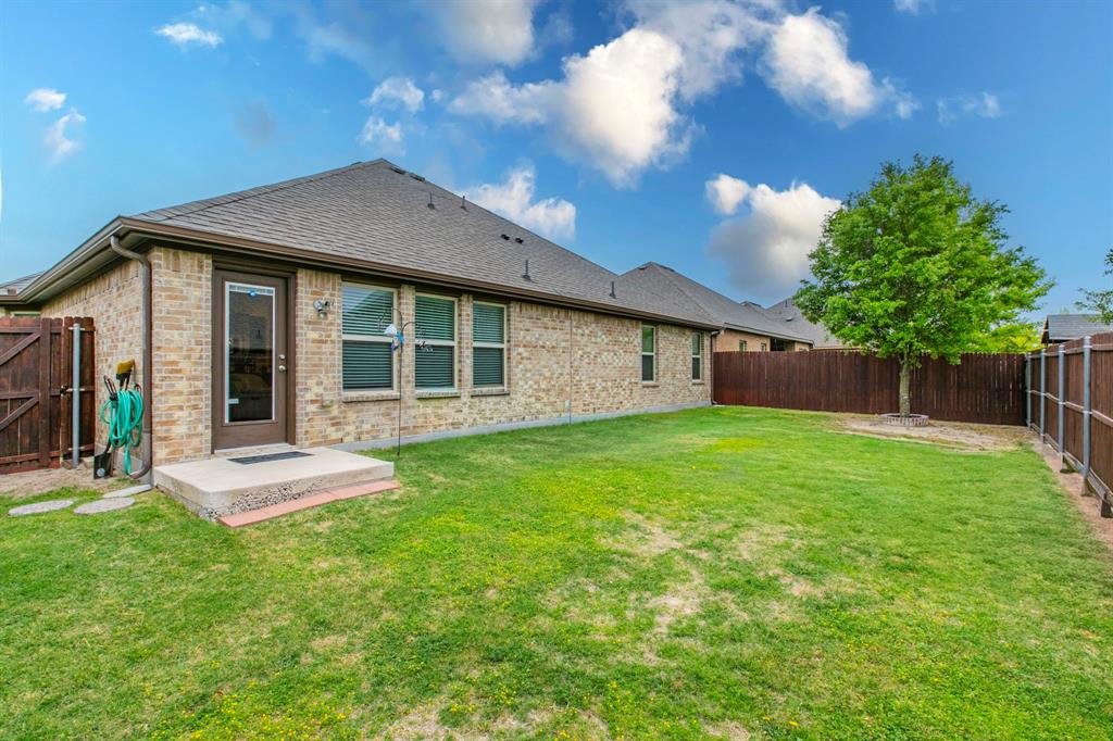 217 Watson Street Red Oak, TX 75154 - Photo 24 of 26 a front view of a house with a yard