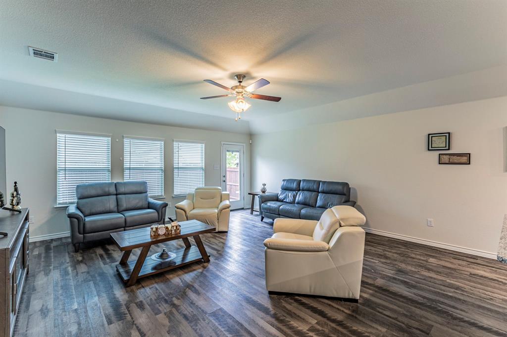 217 Watson Street Red Oak, TX 75154 - Photo 4 of 26 a living room with furniture and wooden floor
