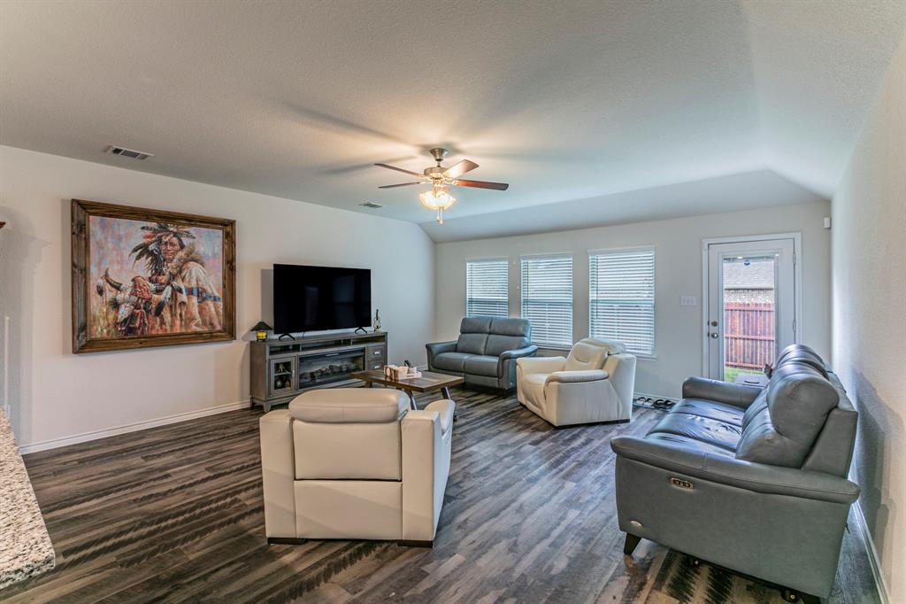 217 Watson Street Red Oak, TX 75154 - Photo 5 of 26 a living room with furniture and a flat screen tv
