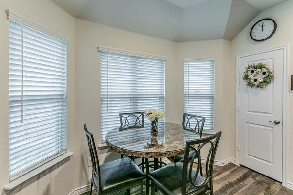 a view of a dining room with furniture and window