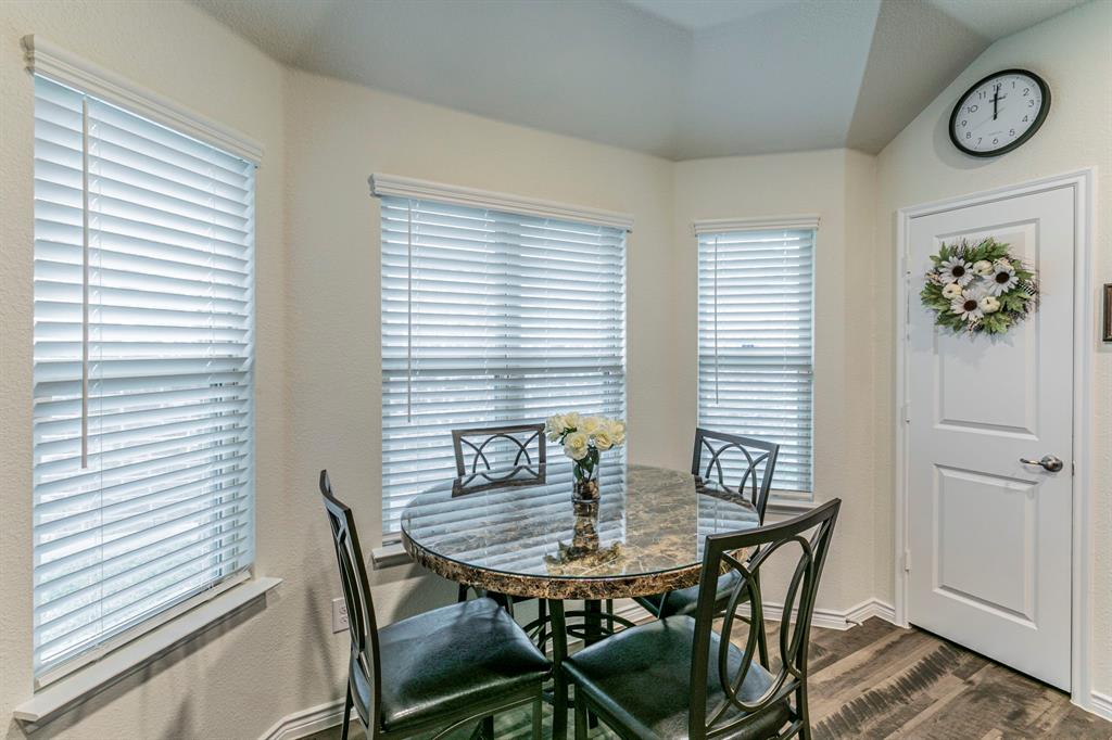 217 Watson Street Red Oak, TX 75154 - Photo 9 of 26 a view of a dining room with furniture and window