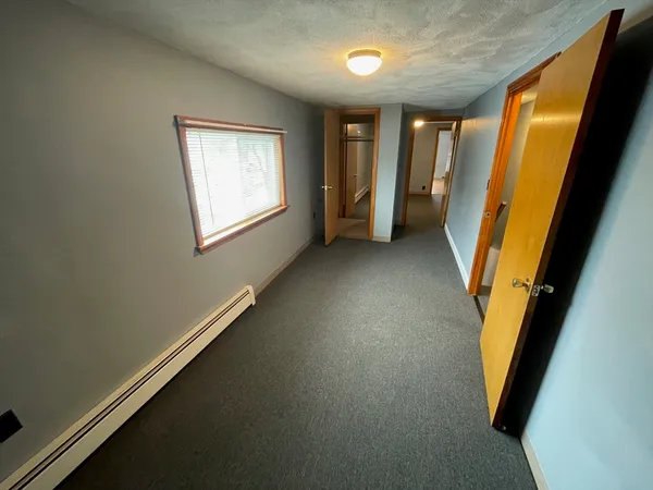 a view of a hallway with windows