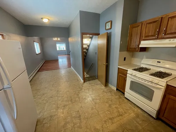 a view of a kitchen with electric appliances