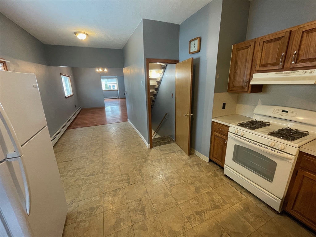 39 Franklin Street, Unit R Woburn, MA 01801 - Photo 5 of 18 a view of a kitchen with electric appliances