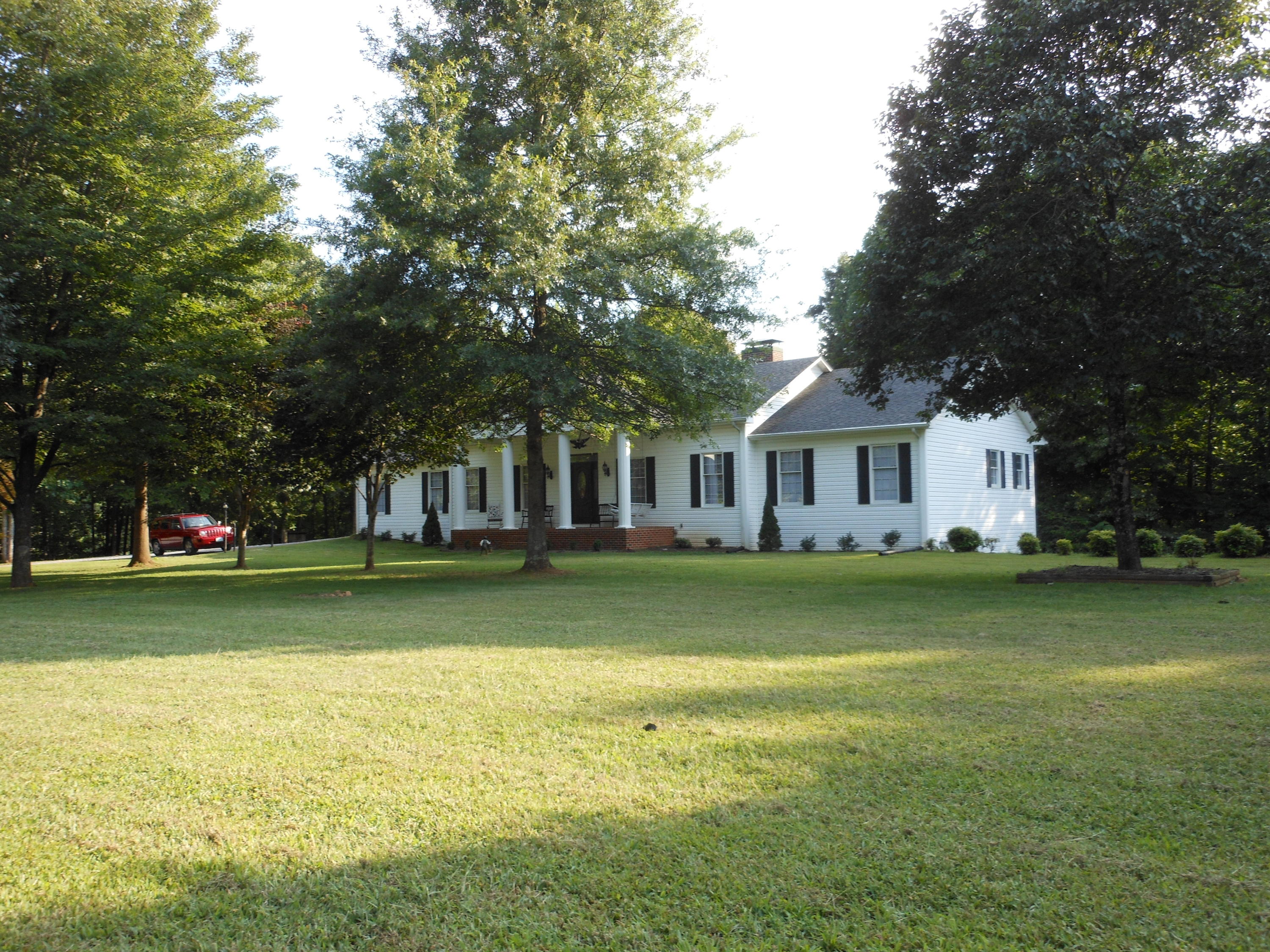 4019 Goodview Road Goodview, VA 24095 - Photo 1 of 47 a front view of a house with a garden
