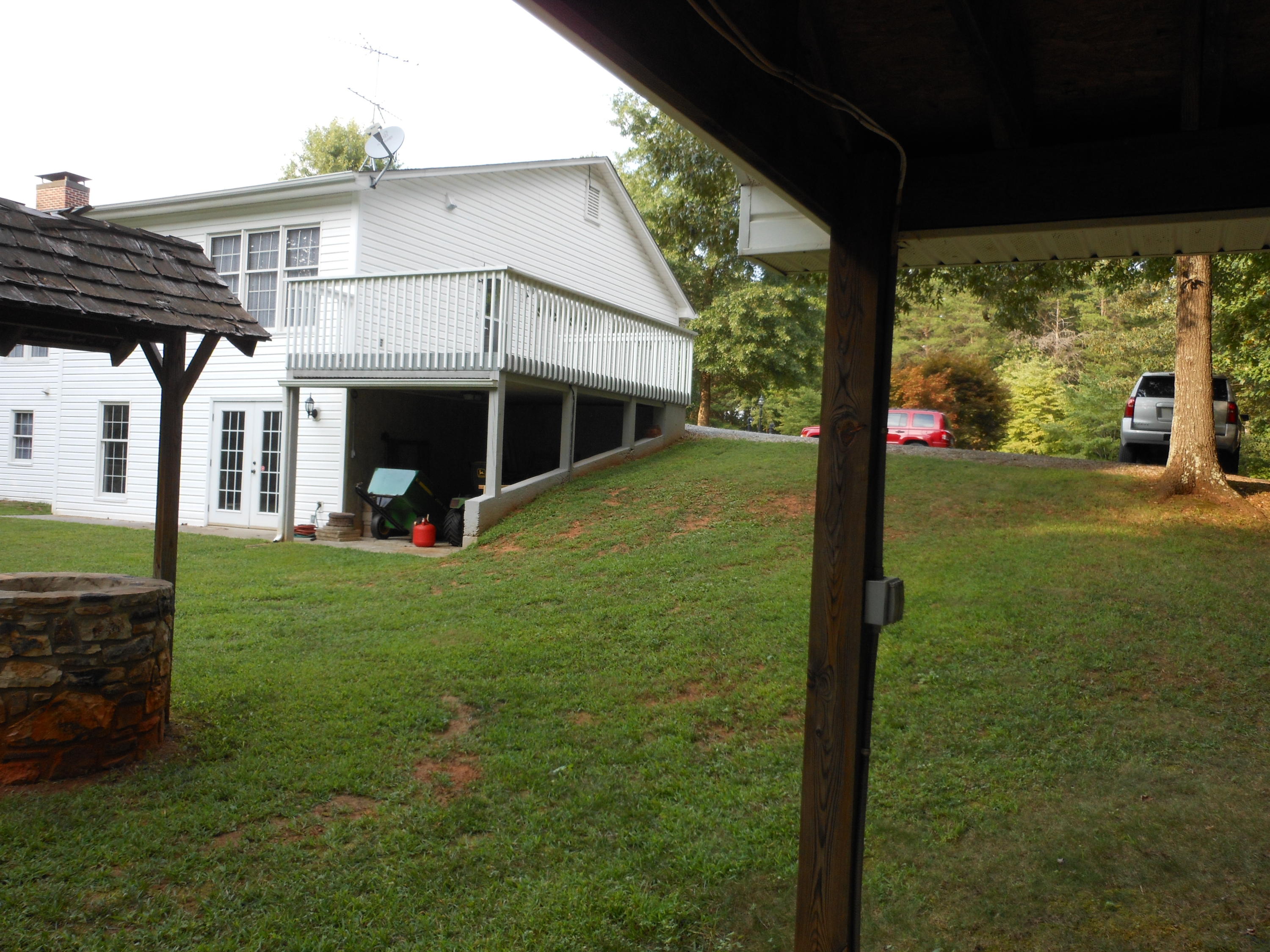 4019 Goodview Road Goodview, VA 24095 - Photo 12 of 47 a view of a house with backyard and porch