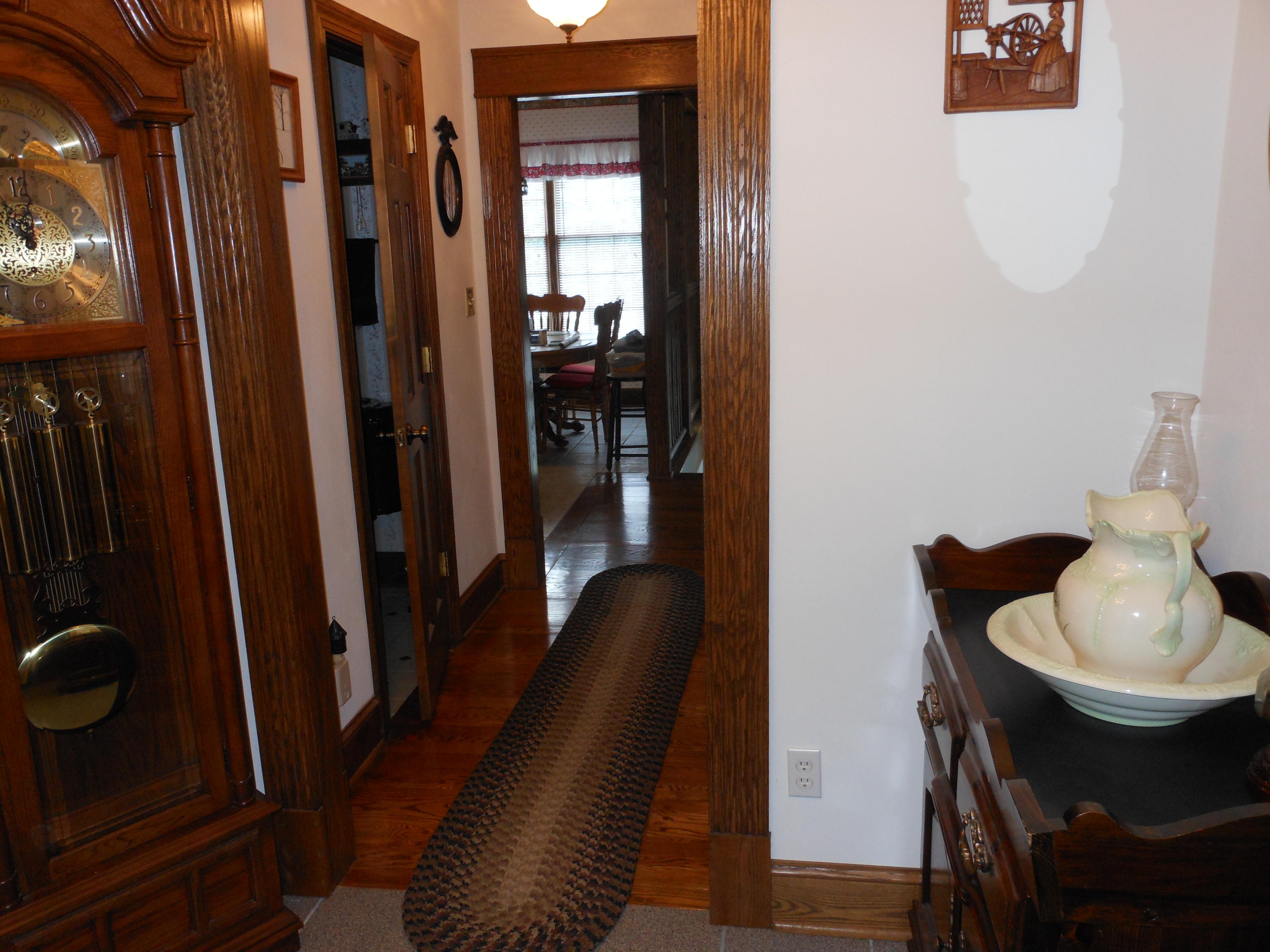 4019 Goodview Road Goodview, VA 24095 - Photo 15 of 47 a view of a hallway with furniture and a potted plant
