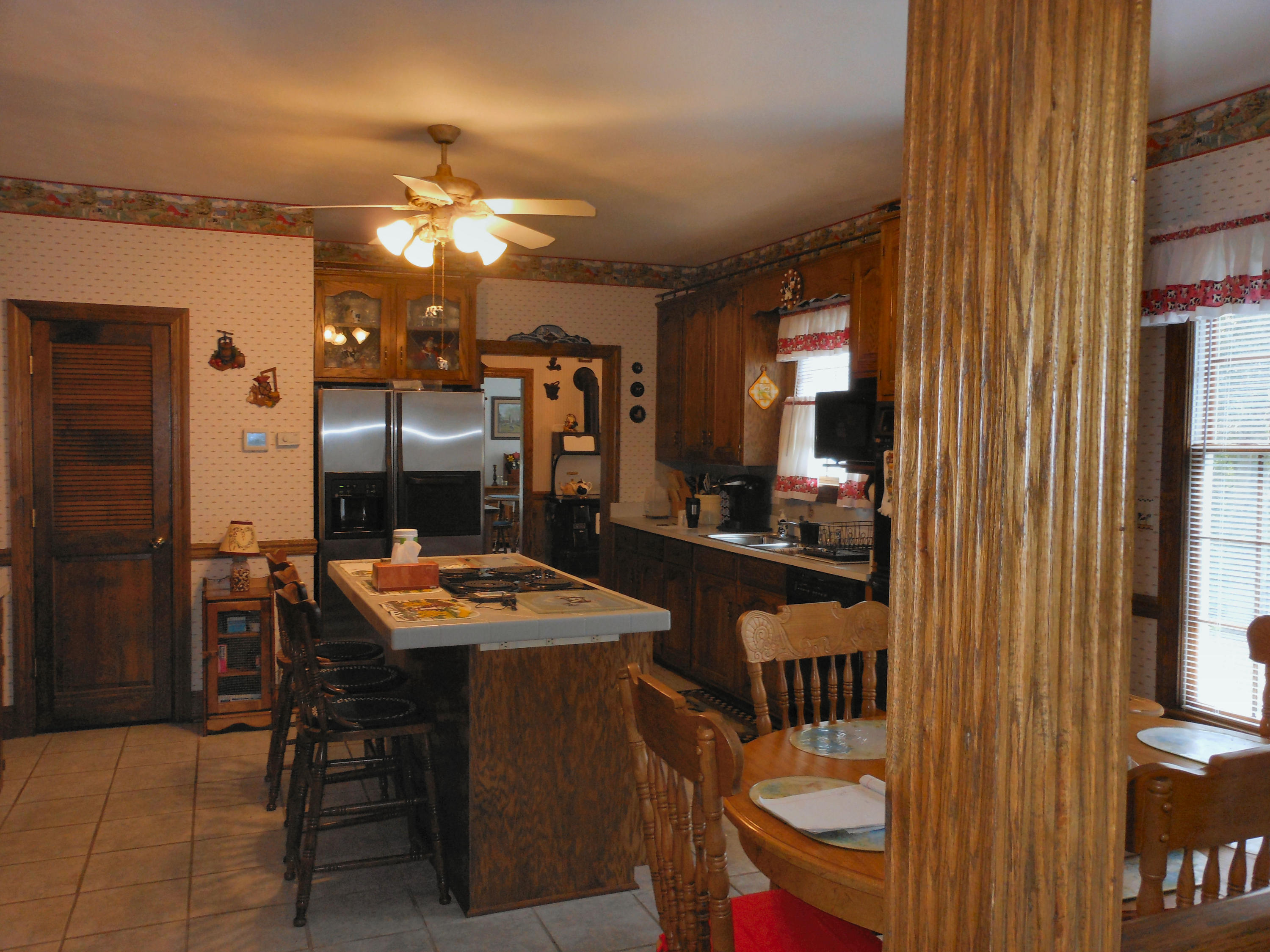 4019 Goodview Road Goodview, VA 24095 - Photo 20 of 47 a dining room with furniture and a chandelier