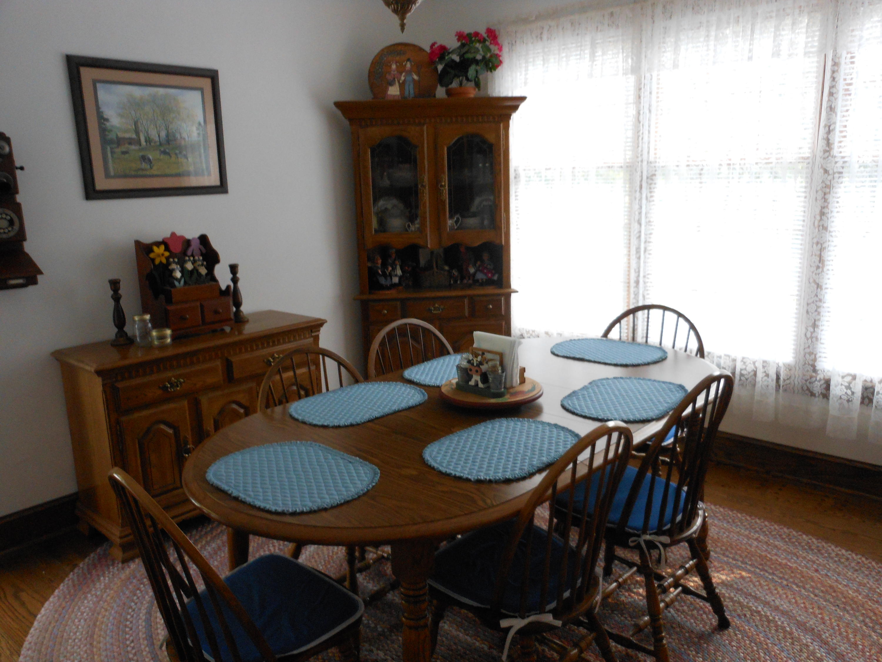 4019 Goodview Road Goodview, VA 24095 - Photo 23 of 47 a view of a dining room with furniture window and wooden floor