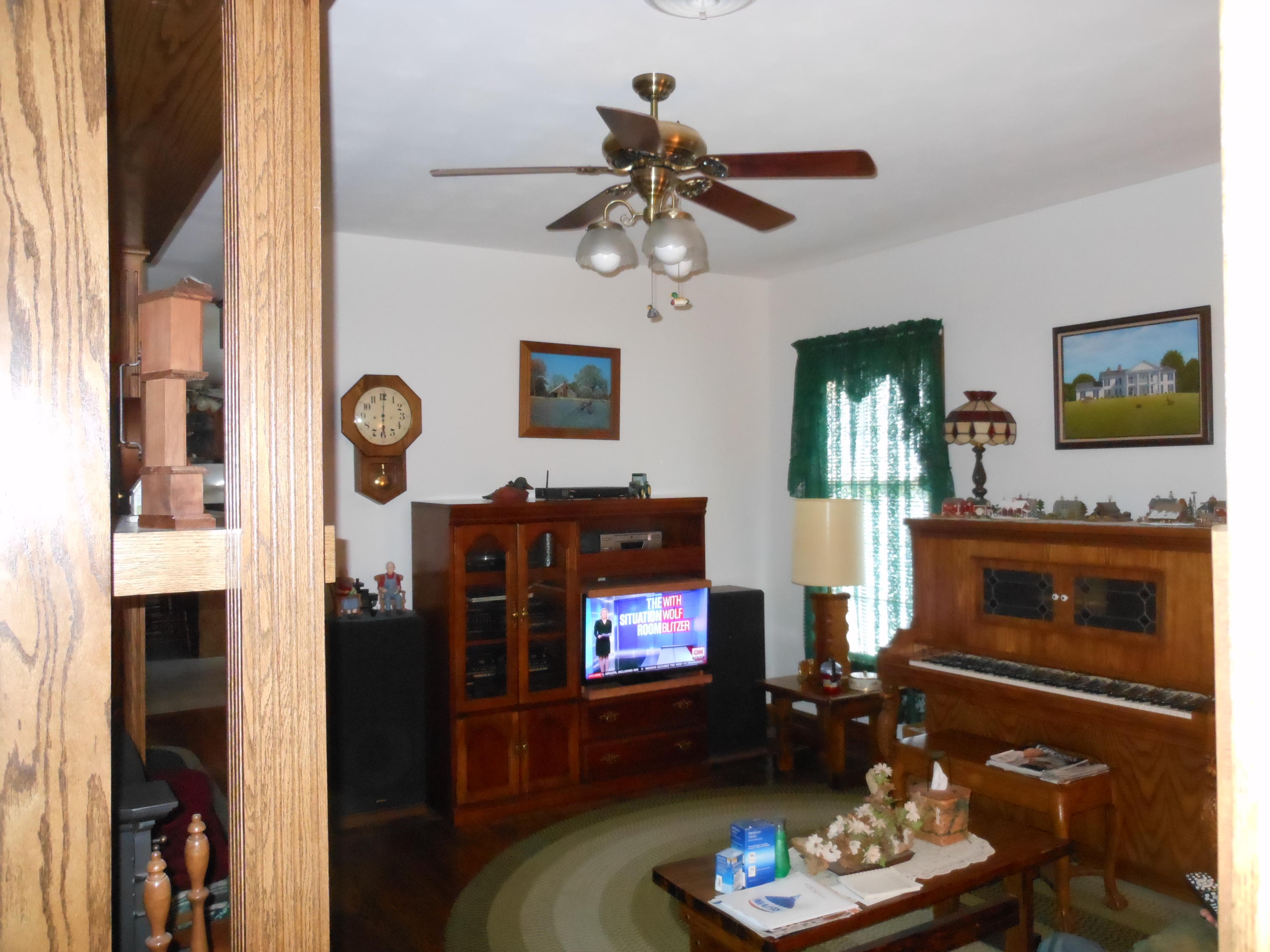 4019 Goodview Road Goodview, VA 24095 - Photo 25 of 47 a living room with furniture a flat screen tv and a fireplace