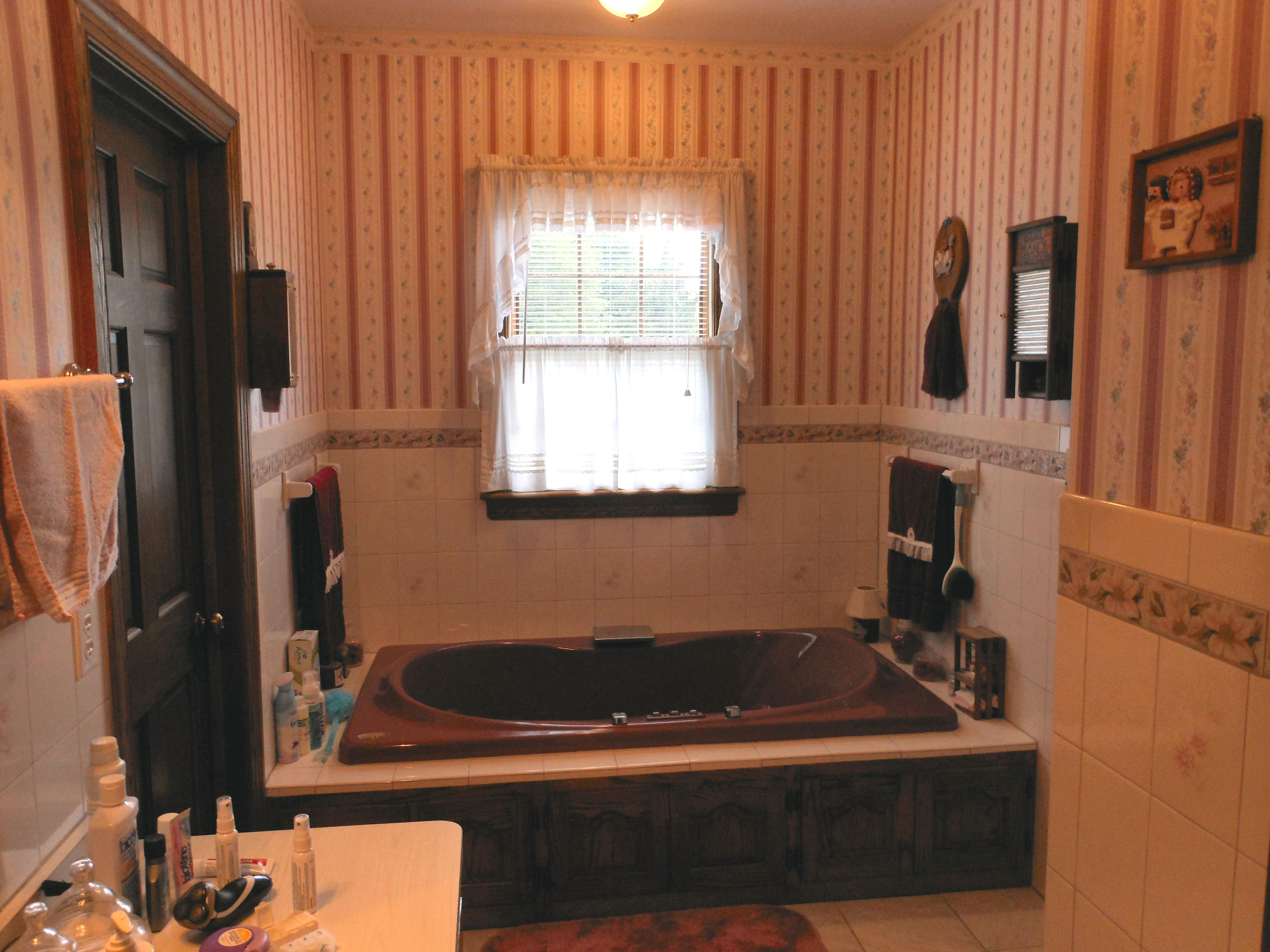 4019 Goodview Road Goodview, VA 24095 - Photo 28 of 47 a bathroom with a bathtub and a window