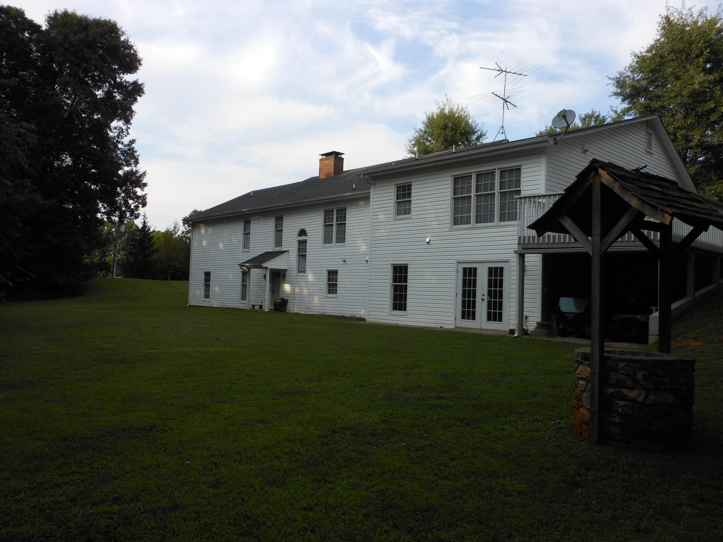 4019 Goodview Road Goodview, VA 24095 - Photo 4 of 47 a view of a white house with a yard