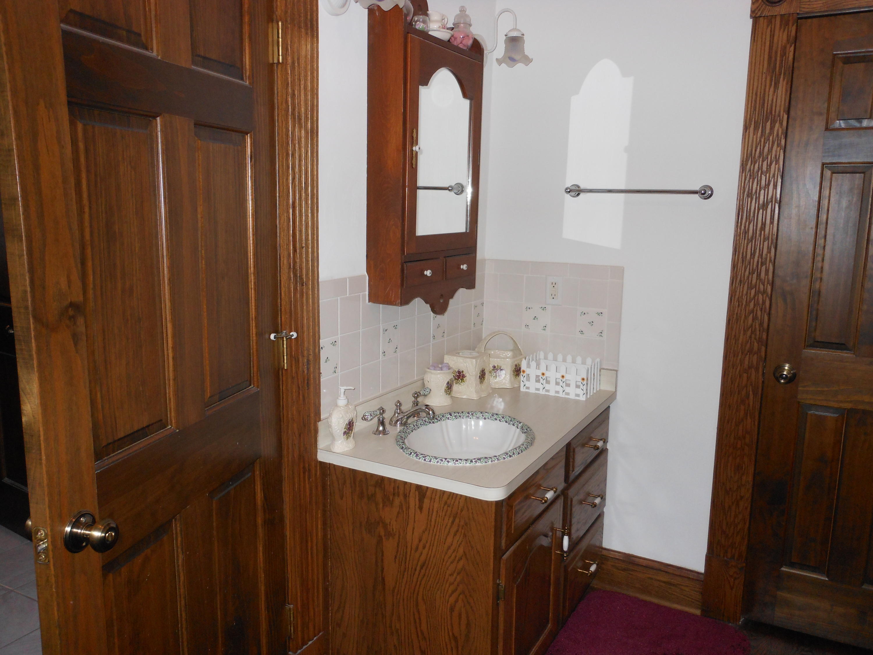 4019 Goodview Road Goodview, VA 24095 - Photo 31 of 47 a bathroom with a sink and a mirror
