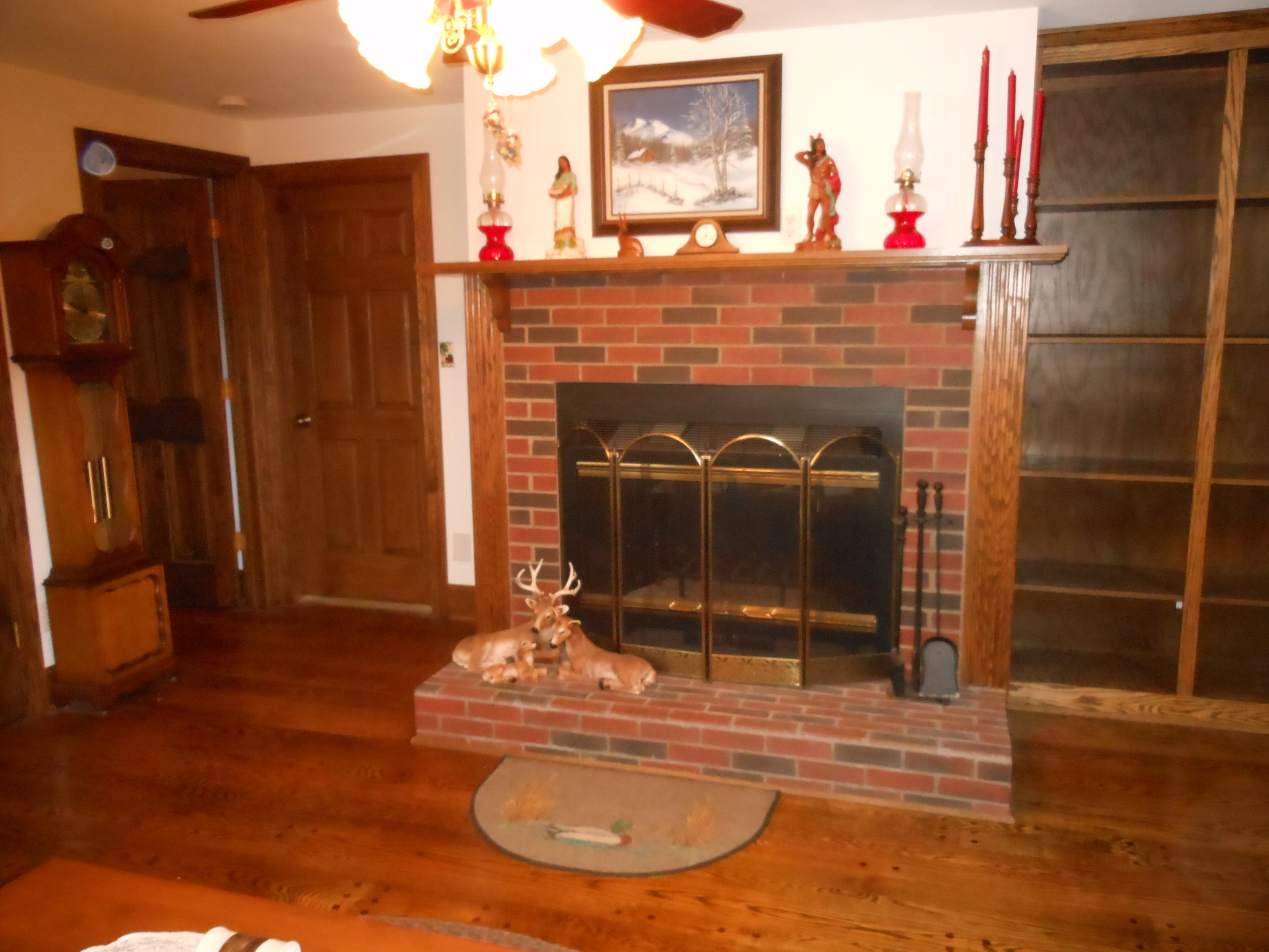 4019 Goodview Road Goodview, VA 24095 - Photo 36 of 47 a room with fireplace and a wooden floor