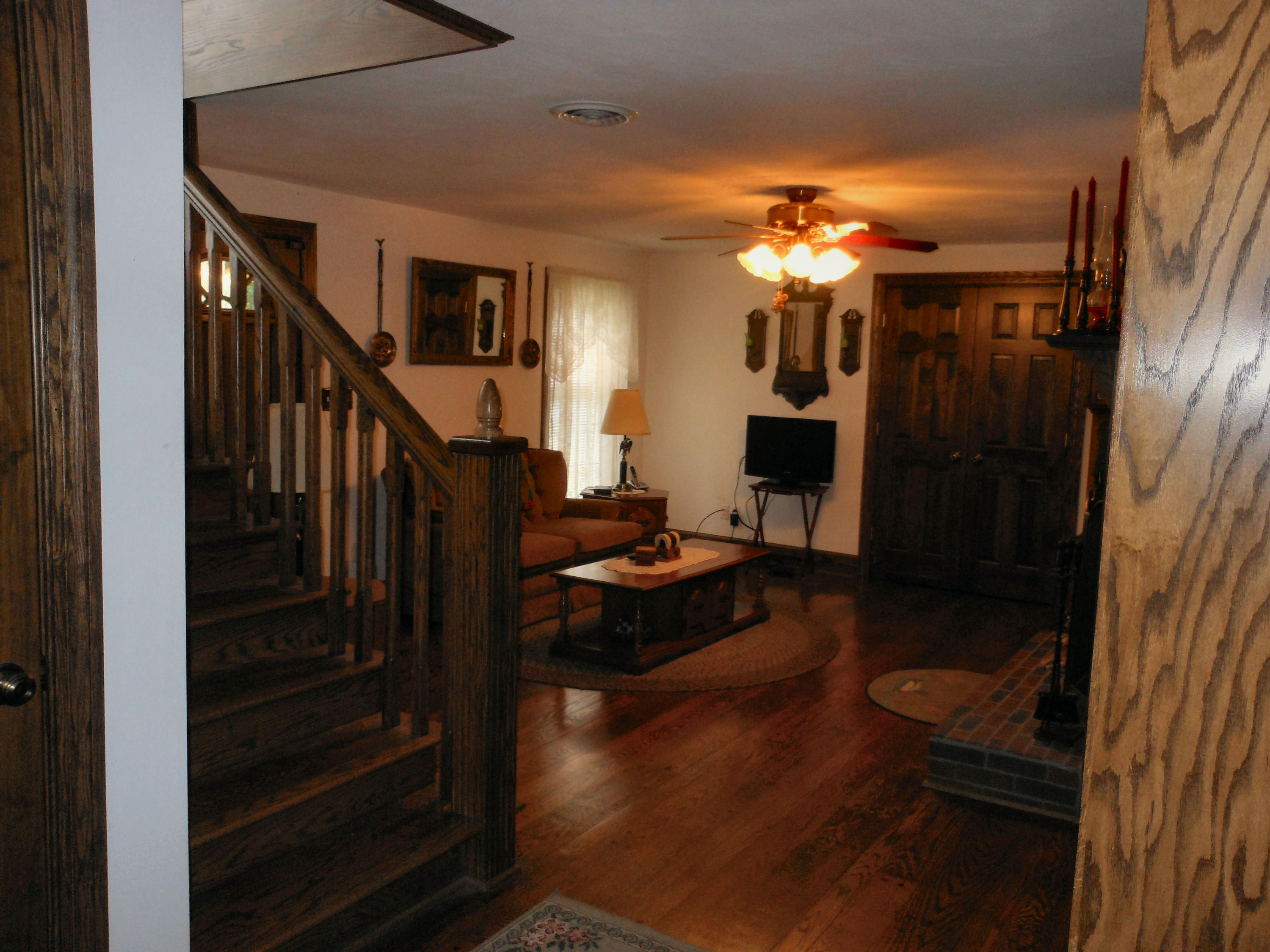 4019 Goodview Road Goodview, VA 24095 - Photo 37 of 47 a view of a hallway with wooden floor and staircase