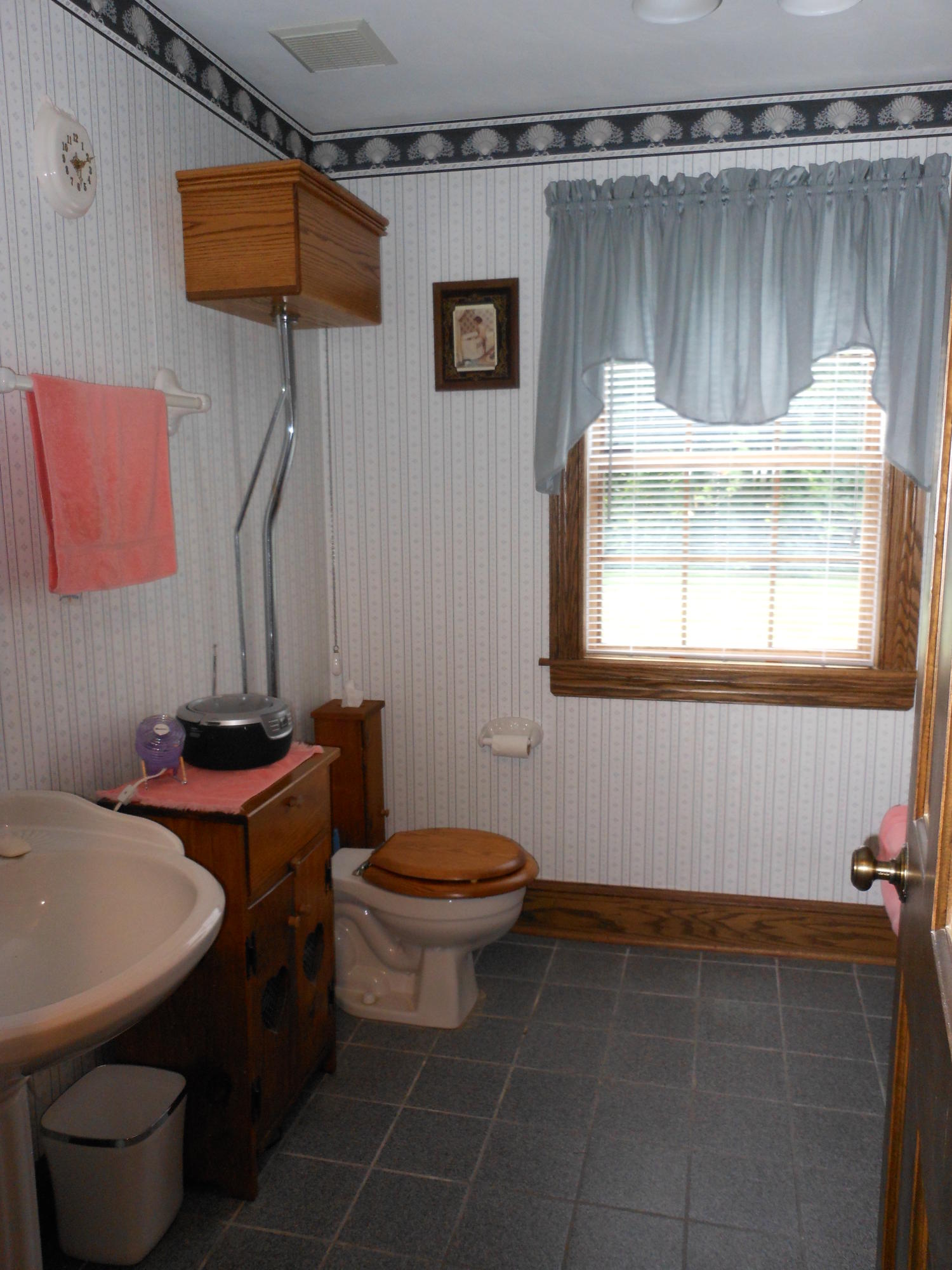 4019 Goodview Road Goodview, VA 24095 - Photo 42 of 47 a bathroom with a toilet a sink and a window