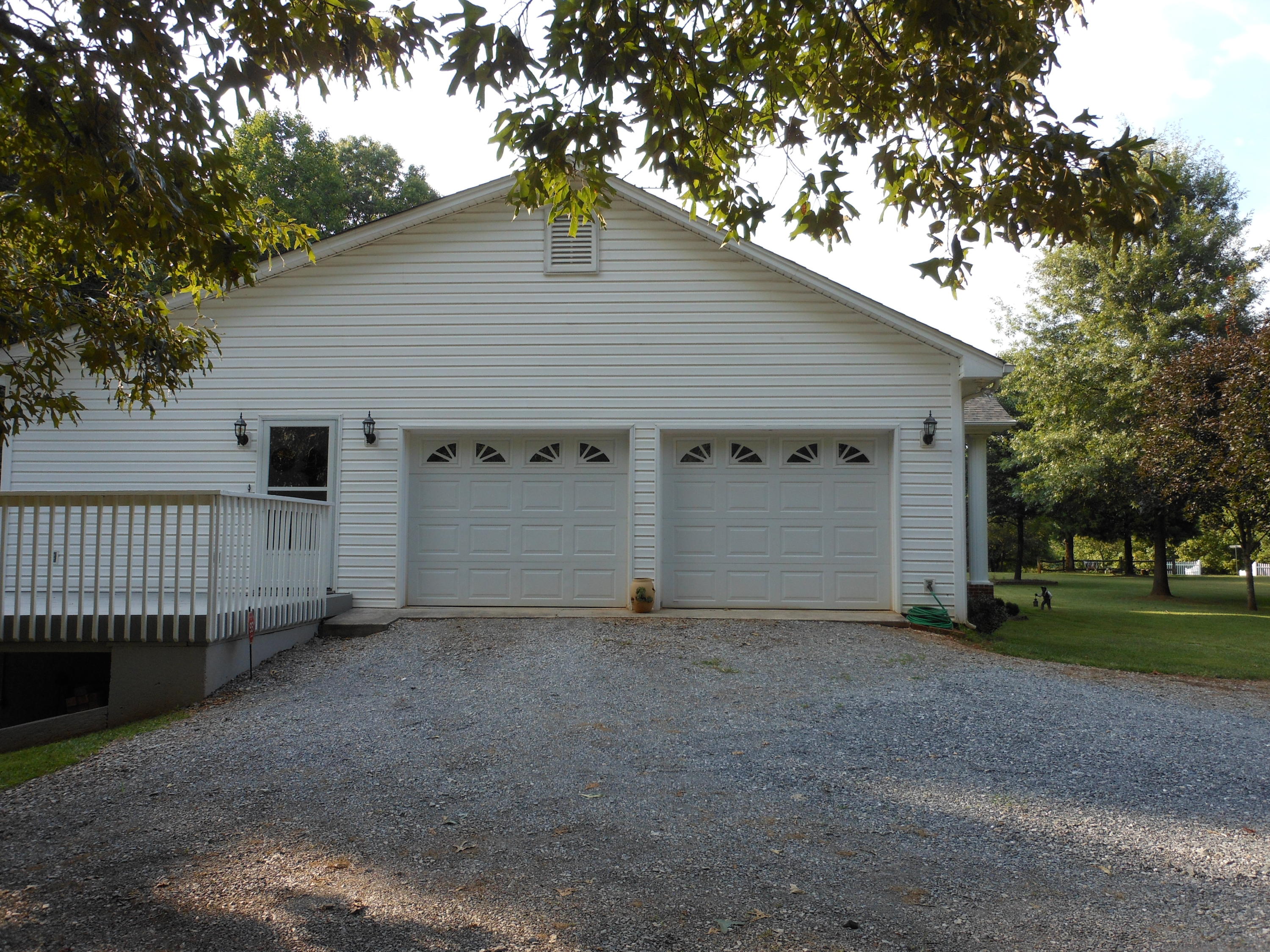 4019 Goodview Road Goodview, VA 24095 - Photo 9 of 47 a view of a house with a yard and garage