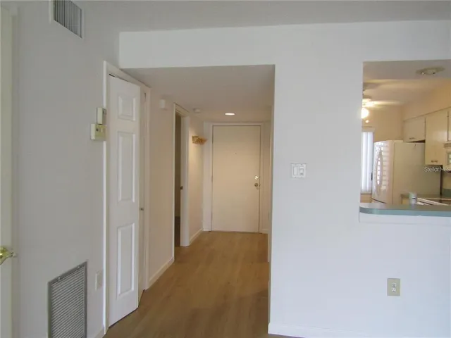 a view of a bathroom from a hallway