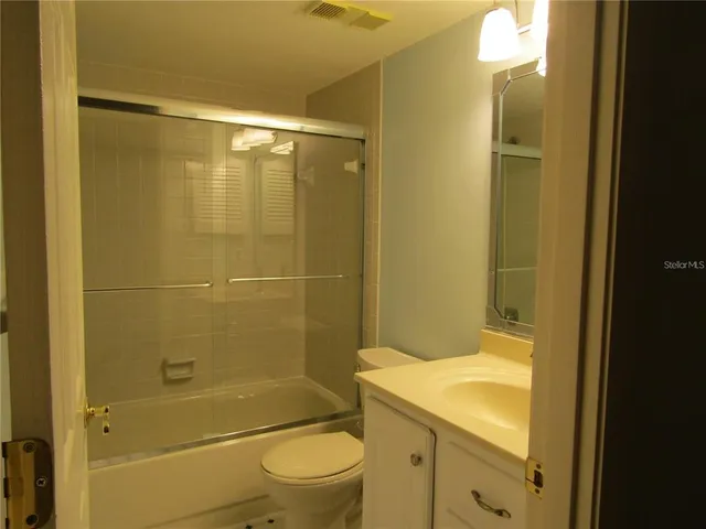 a bathroom with a shower and a toilet