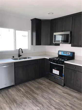 a kitchen with a sink and a stove