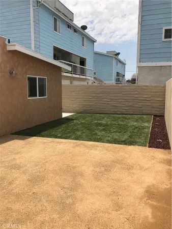 a view of a backyard of the house