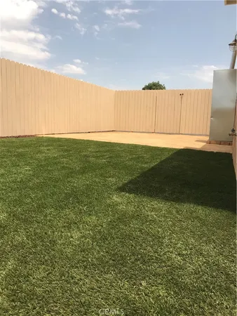 a view of backyard with green space