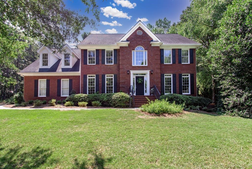 2048 Old Conyers Road Stockbridge, GA 30281 - Photo 1 of 1 a front view of a house with a yard