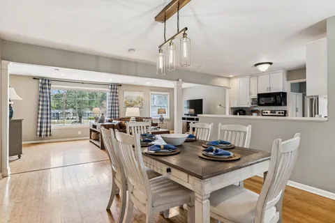 a view of a dining room with furniture window and outside view