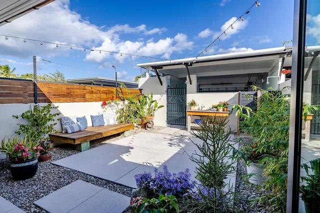 a view of a backyard with sitting area