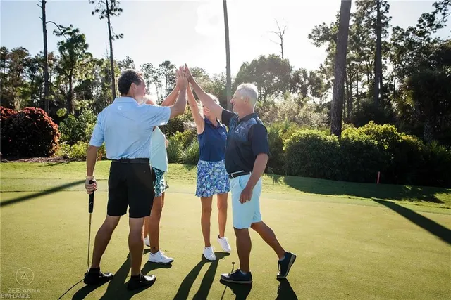 a vase of flowers sitting on a table with a fireplace