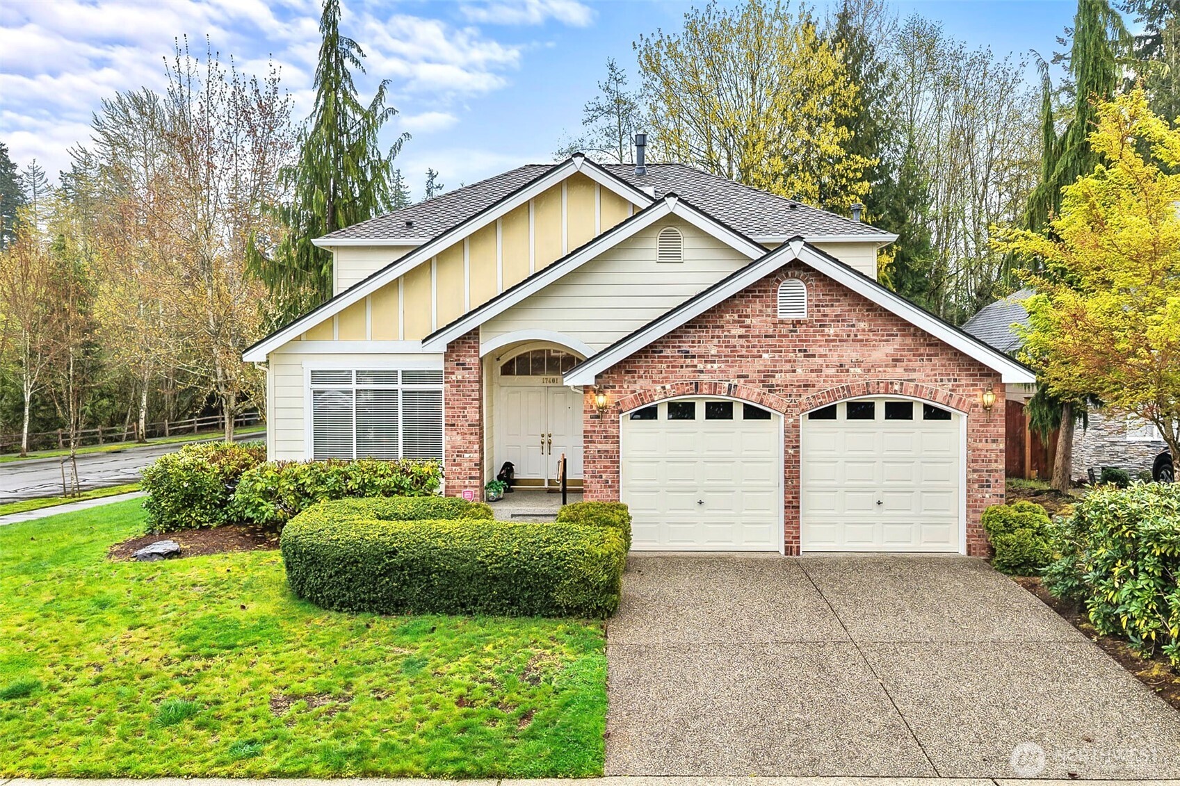 17401 33rd Drive Southeast Bothell, WA 98012 - Photo 38 of 39 a view of a white house with a small yard plants and large tree