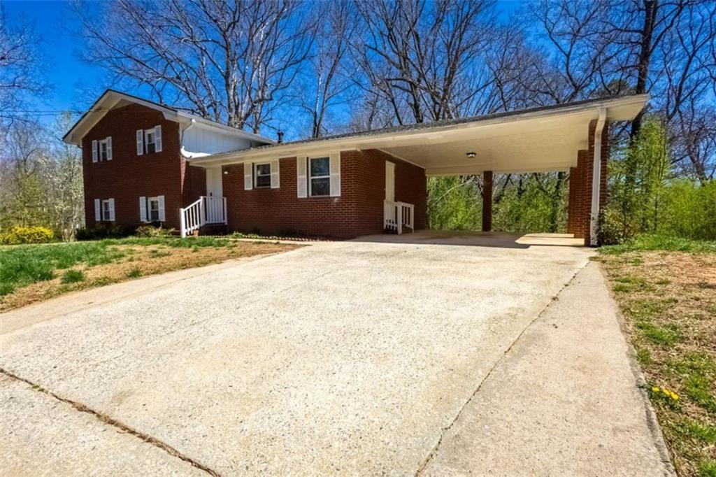 2742 Bomar Road Douglasville, GA 30135 - Photo 1 of 1 a front view of a house with a yard