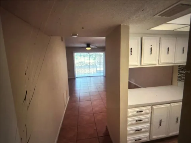 a view of kitchen with furniture and wooden floor