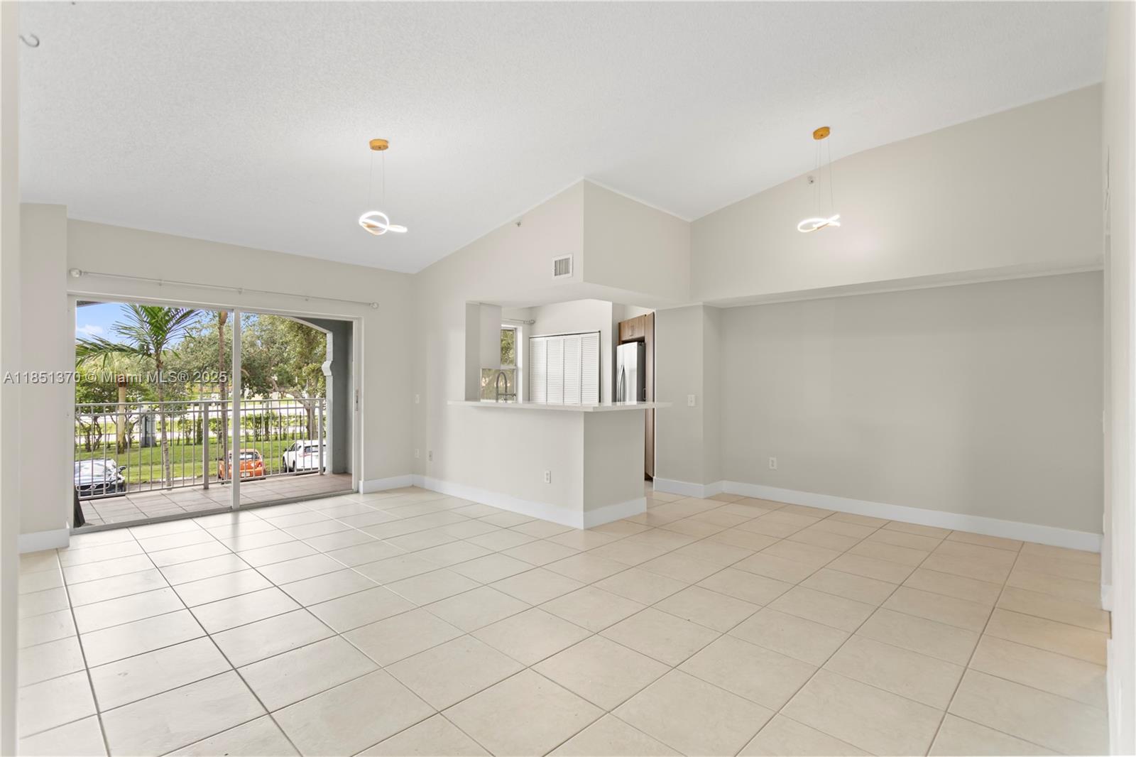 9645 Northwest 1st Court, Unit 1209 Pembroke Pines, FL 33024 - Photo 17 of 70 a view of an empty room with a window