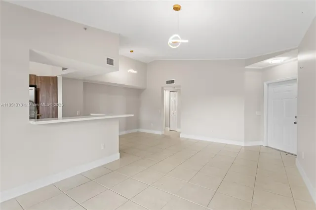 a view of an empty room and window