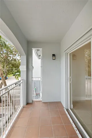 a kitchen with sink a refrigerator and cabinets