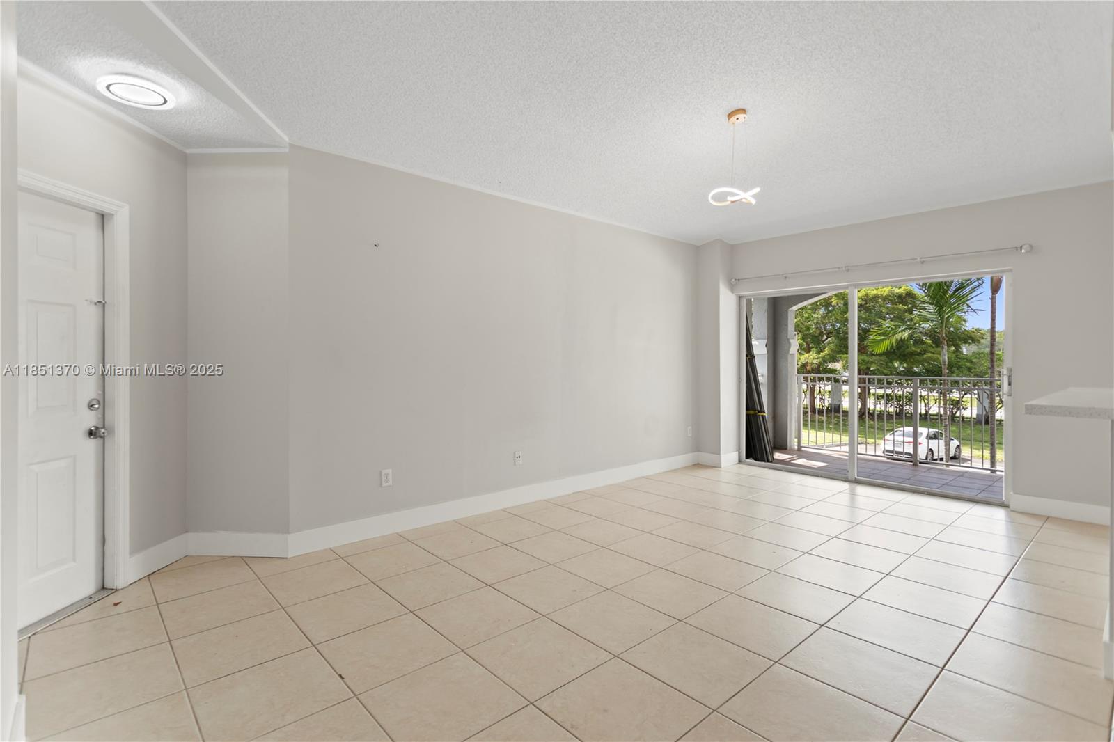 9645 Northwest 1st Court, Unit 1209 Pembroke Pines, FL 33024 - Photo 24 of 70 a view of an empty room and window