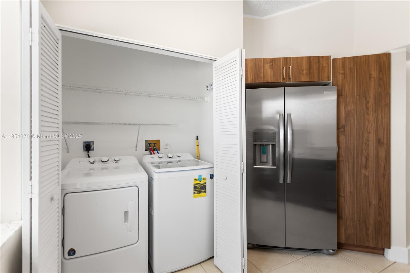 9645 Northwest 1st Court, Unit 1209 Pembroke Pines, FL 33024 - Photo 33 of 70 a utility room with dryer and washer