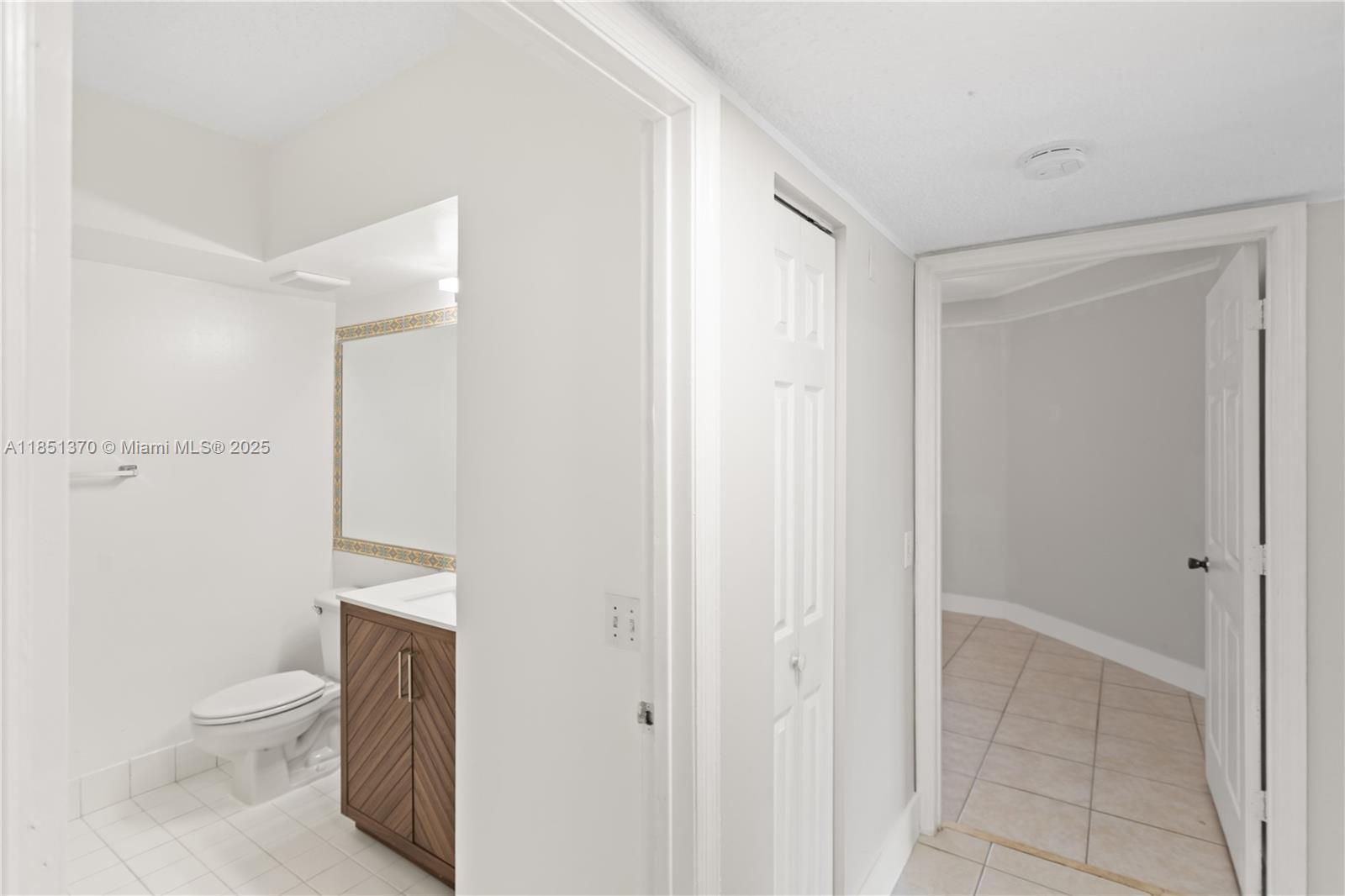 9645 Northwest 1st Court, Unit 1209 Pembroke Pines, FL 33024 - Photo 42 of 70 a bathroom with a toilet a sink and shower